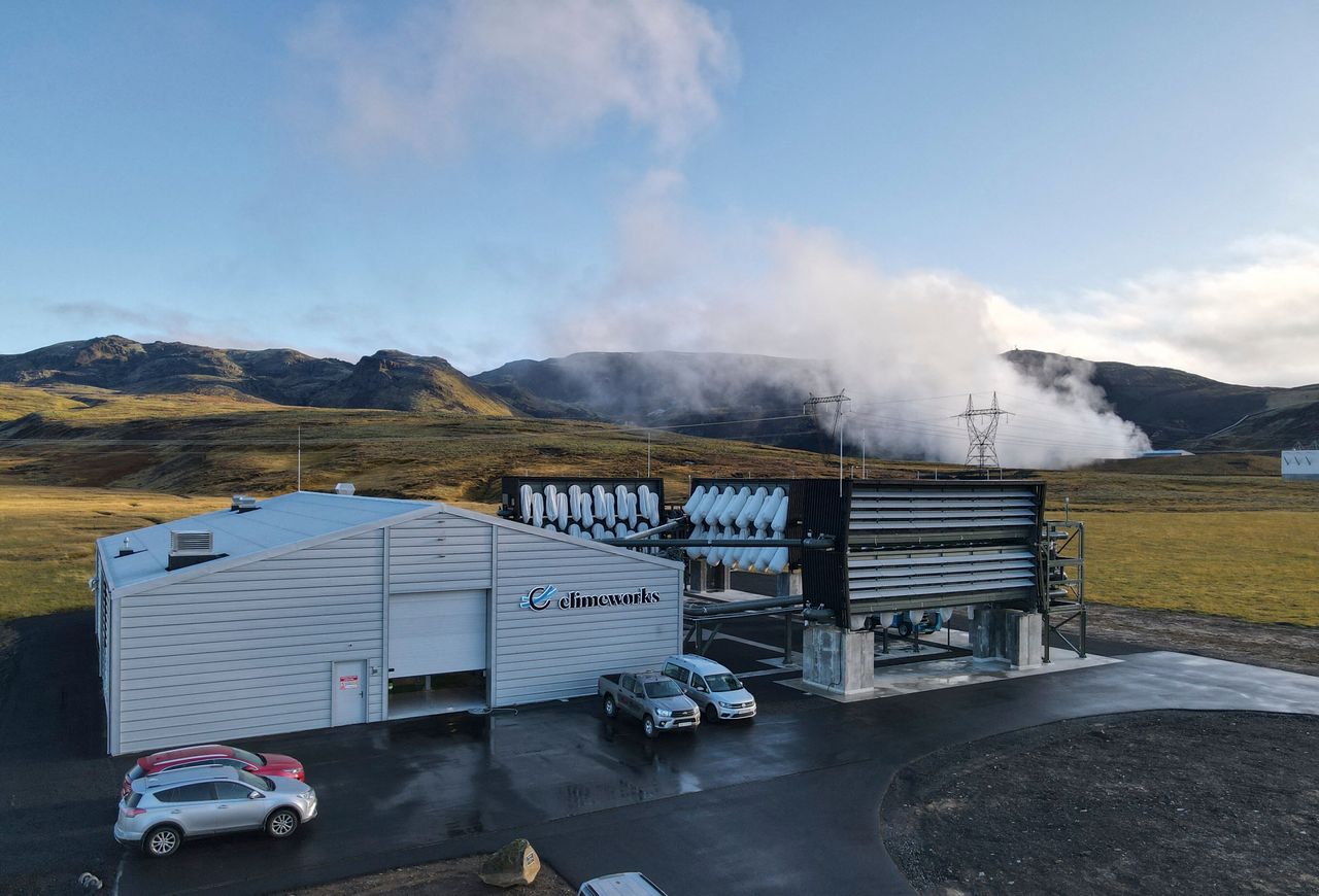 Climeworks factory with it's fans in front of the collector, drawing in ambient air and release it, as largely purified CO2 through ventilators at the back is seen at the Hellisheidi power plant near Reykjavik on October 11, 2021. 