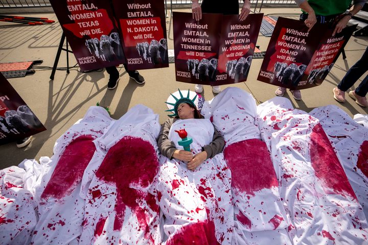 Abortion rights supporters participate in a "die-in" outside the Supreme Court on April 24, 2024, in Washington, D.C.