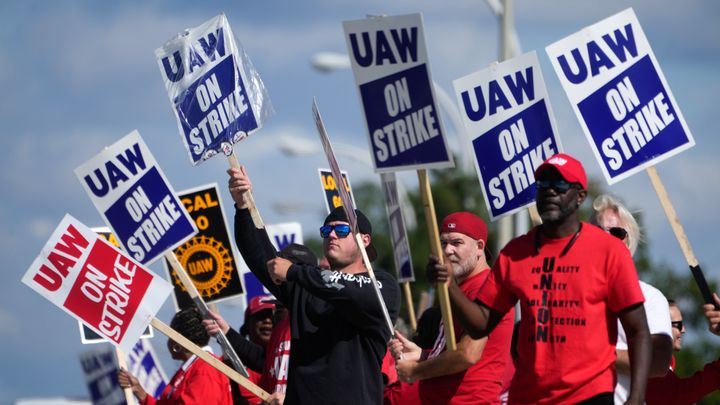 Auto workers on strike outside Ford's Michigan Assembly Plant in Wayne, Mich., last September. The union has shifted its contracts so that they expire just before May Day.