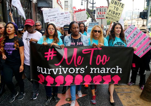 Tarana Burke, founder and leader of the #MeToo movement, marches center with others at the 2017 #MeToo March in the Hollywood section of Los Angeles. 