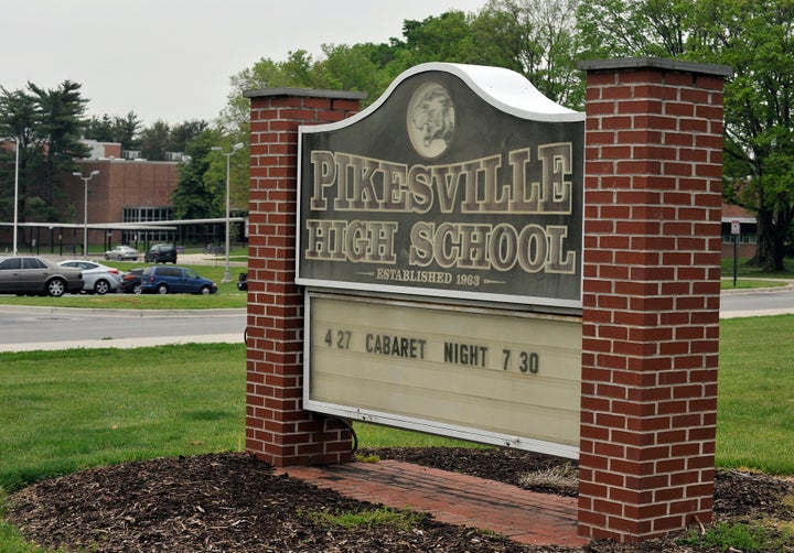 This undated photo shows the The Pikesville High School sign on the school property. Baltimore County Police Chief Robert McCullough and other local officials speak at a news conference in Towson, Maryland, on Thursday, April 25, 2024. The officials discussed the arrest of a high school athletic director on charges that he used artificial intelligence to impersonate a principal on an audio recording that included racist and antisemitic comments. (Lloyd Fox/The Baltimore Sun via AP)