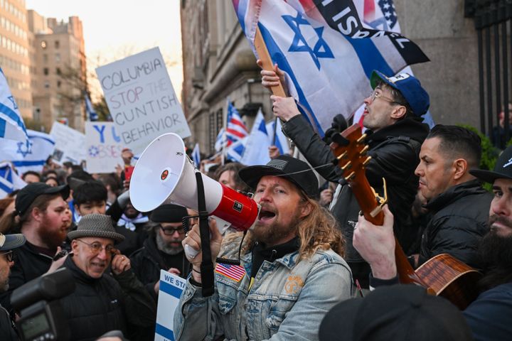 Sean Feucht leads the United For Israel March outside Columbia University on April 25 in New York City. Feuch called on Columbia’s president to resign. Pro-Palestinian protesters clashed in small numbers with pro-Israel protesters, many who chanted “bring them home” and “remove your mask.”