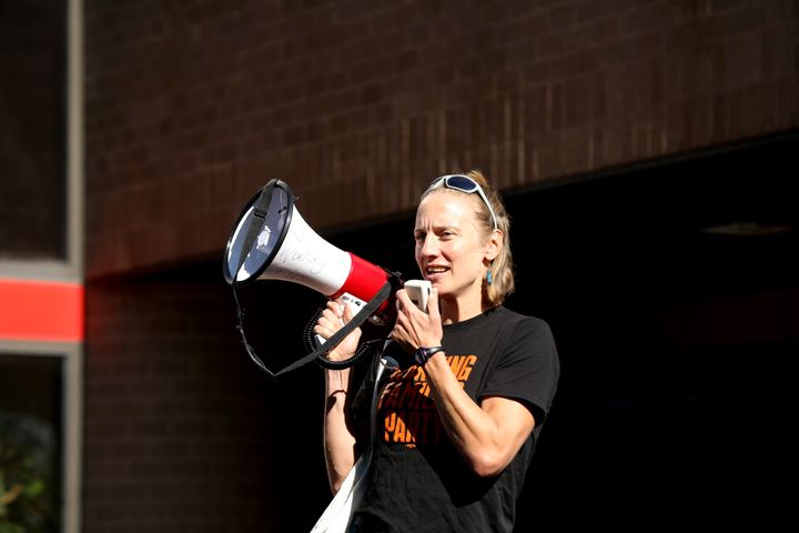 Sue Altman, in her megaphone days, leads a protest outside Rep. Josh Gottheimer's district office in August 2021. Republicans have dubbed her "A-O-Sue."