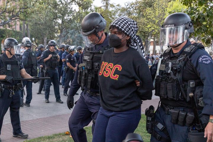 Members of the law enforcement intervene the pro-Palestinian student protest condemning Israel's attacks on Gaza, at the University of Southern California in Los Angeles on April 24, 2024.