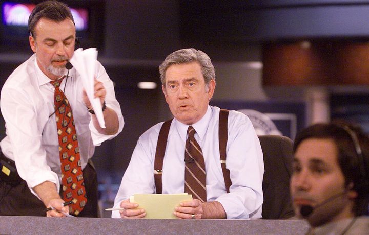 FILE - CBS News anchor Dan Rather reads from cue cards during a dress rehearsal of CBS News' election night 2000 coverage Friday, Nov. 3, 2000, in New York. Rather returned to the CBS News airwaves Sunday, April 28, 2024, for the first time since his bitter exit 18 years ago, appearing in a reflective interview on “CBS Sunday Morning” days before the debut of a Netflix documentary on the 92-year-old newsman's life. (AP Photo/Mark Lennihan, File)