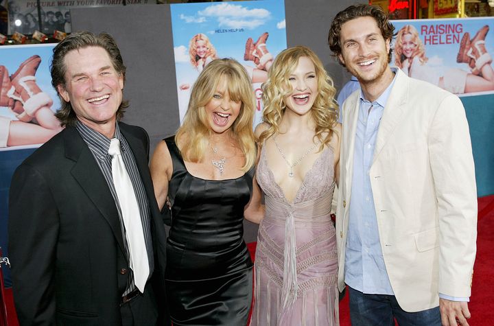 Kurt Russell and his partner, Goldie Hawn, and her children Kate and Oliver Hudson attend the film premiere of "Raising Helen" on May 26, 2004.