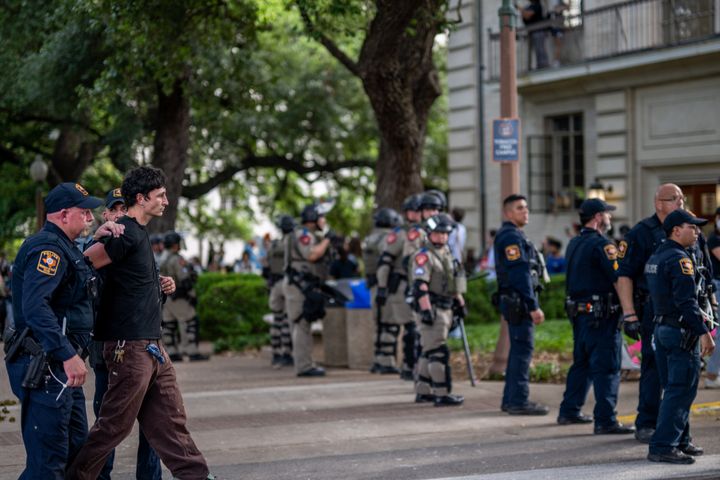 A University of Texas student is arrested Monday during a protest against Israel's attacks on Gaza. Students at the Austin campus walked out of class and gathered in protest while students and professors at other colleges across the country also showed support for Palestinian civilians in the war zone.