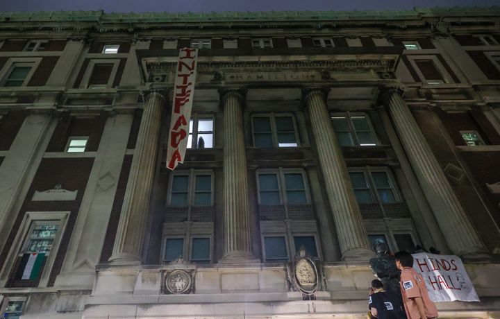 A group of Columbia University students, advocating for Palestinians, enter the iconic Hamilton Hall building as they gather to stage a demonstration at the campus in New York, United States on April 30, 2024.