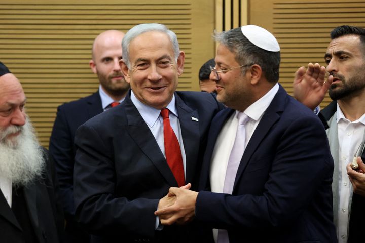 Israeli Prime Minister Benjamin Netanyahu greets National Security Minister Itamar Ben-Gvir during a media briefing ahead of a vote on the national budget, on May 23, 2023, at the parliament in Jerusalem.