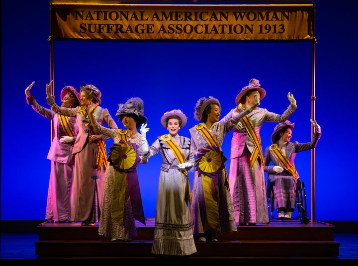 Jenn Colella (center) and the company of Broadway's "Suffs."