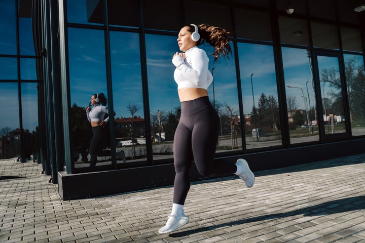 Young athletic woman jogging in the city