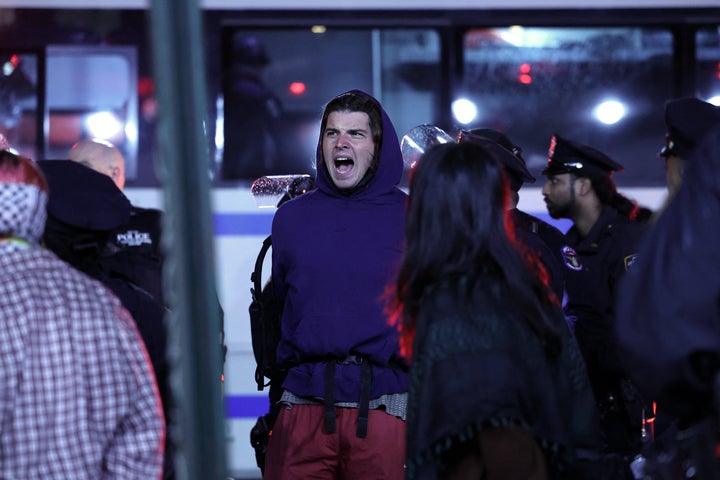 NYPD officers arrest students as they evict a building that had been barricaded by pro-Palestinian student protesters at Columbia University, in New York City on April 30, 2024.