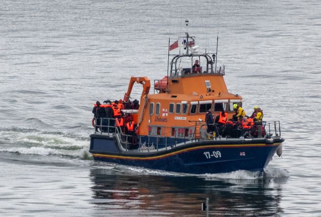 Migrants are brought into Dover Port by a RNLI lifeboat after being picked up in the English Channel.