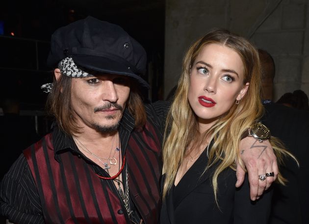 Johnny Depp and Amber Heard attend the 2016 Grammy Awards. A joke about their rocky relationship is at the center of a minor controversy.