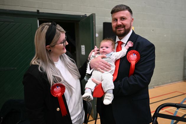 Labour candidate Chris Webb with his wife Portia and son Cillian wait for the declaration at the count centre in Blackpool.