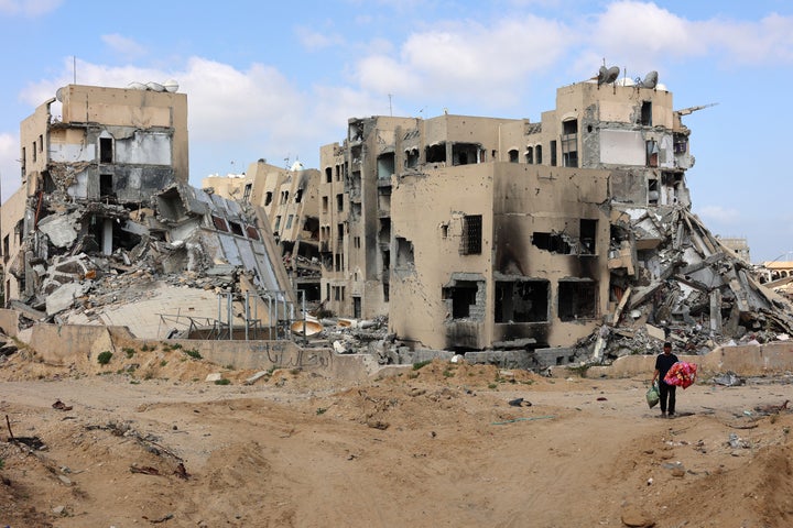 TOPSHOT - A Palestinian man carries belongings in Beit Lahya in the northern Gaza Strip on May 4, 2024, amid the ongoing conflict between Israel and the militant group Hamas. (Photo by AFP) (Photo by -/AFP via Getty Images)