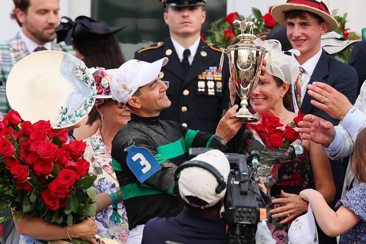 LOUISVILLE, KENTUCKY - MAY 04: Mystik Dan's jockey Brian Hernandez Jr. celebrates with the trophy after winning the 150th running of the Kentucky Derby at Churchill Downs on May 04, 2024 in Louisville, Kentucky. (Photo by Michael Reaves/Getty Images)