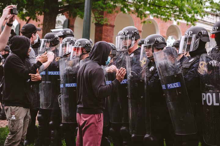 CHARLOTTESVILLE, VIRGINIA - MAY 04: A protesters confronts the police on University grounds after the police declared an unlawful gathering on the grounds of the University of Virginia. on May 4, 2024 in Charlottesville, Virginia. Pro-Palestinian encampments have sprung up at college campuses around the country with some demonstrators calling for schools to divest from Israeli interests amid the ongoing war in Gaza. (Photo by Eze Amos/Getty Images)