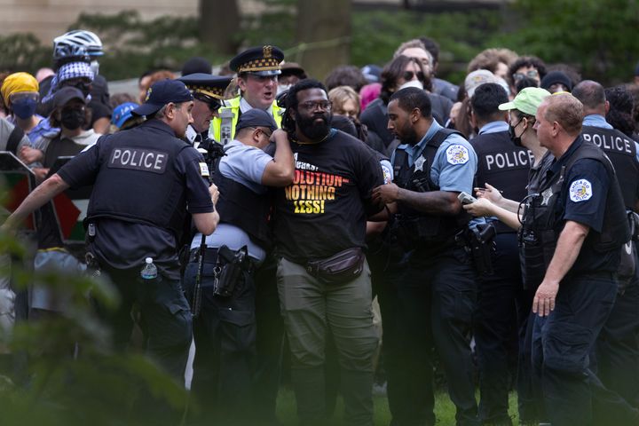 Police take demonstrators into custody on the campus of the Art Institute of Chicago after students established a protest encampment on the grounds on May 4, 2024 in Chicago. More than 2,000 people have been arrested nationwide as students at colleges and universities around the country have staged protests calling for a ceasefire in Gaza.