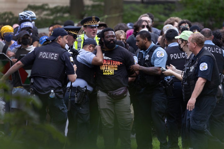 Police take demonstrators into custody on the campus of the Art Institute of Chicago after students established a protest encampment on the grounds on May 4, 2024 in Chicago. More than 2,000 people have been arrested nationwide as students at colleges and universities around the country have staged protests calling for a ceasefire in Gaza.