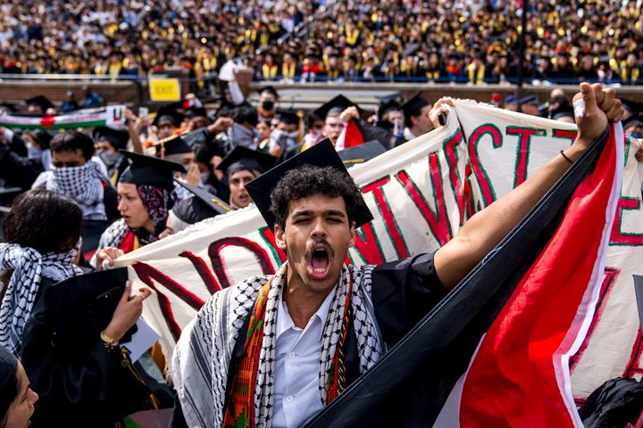 Joseph Fisher chants during a pro-Palestinian protest during the University of Michigan's spring commencement ceremony on May 4, 2024 at Michigan Stadium in Ann Arbor, Michigan.