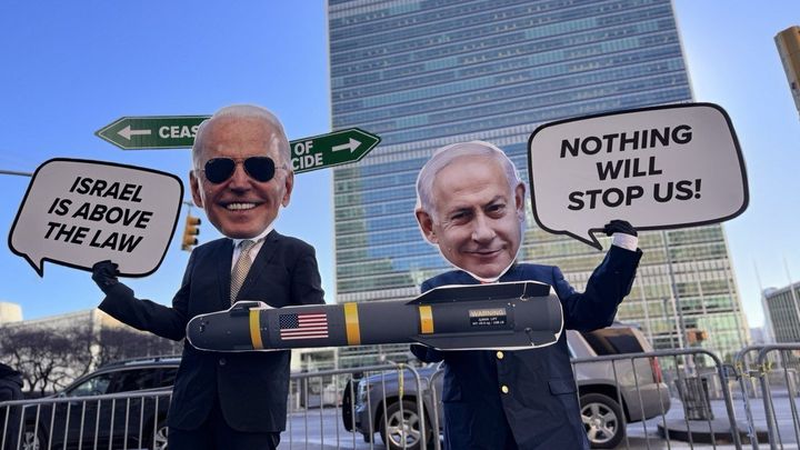 Cardboard cutouts by protesters show Israeli Prime Minister Benjamin Netanyahu riding a U.S. missile ahead of the Gaza cease-fire vote by the UN Security Council in New York City on Feb. 20.