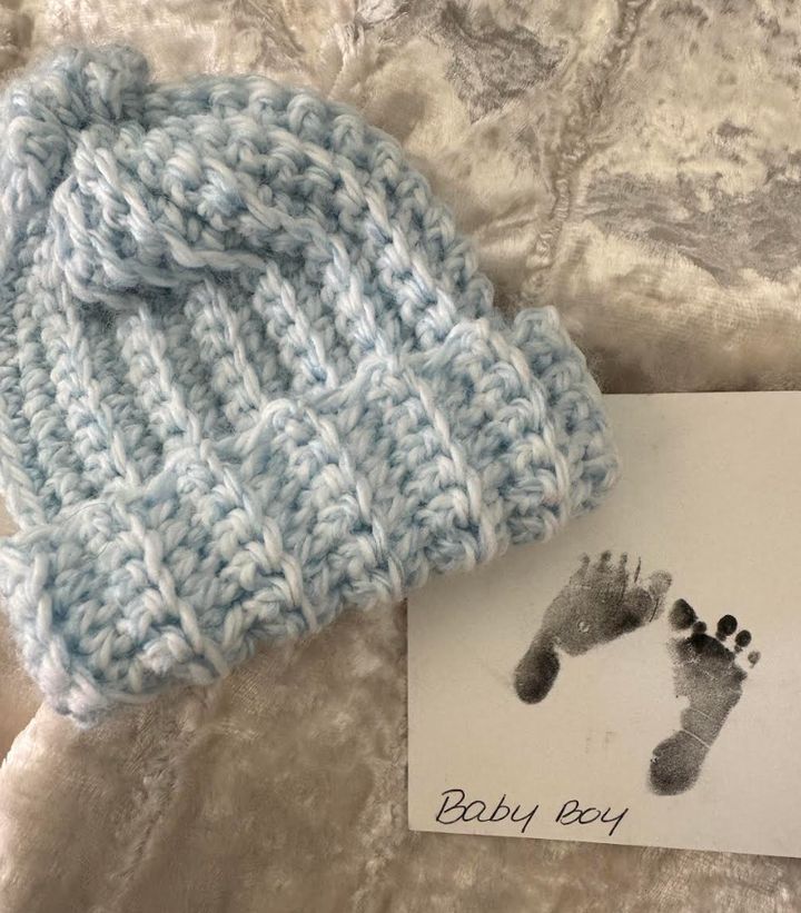 "This is Benjamin's baby hat and footprints from the hospital," the author writes. "After I refused photos with him, one of my nurses called the nonprofit, Now I Lay Me Down to Sleep, and a photographer volunteer came to take pictures of him. The nurse also put together a memorial box with his hat, footprints, and the baby blanket he was wrapped in. I am forever grateful for their kindness."