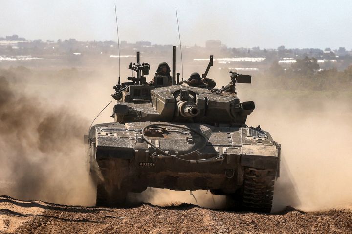 An Israeli army battle tank moves along the border of the Gaza Strip and southern Israel on May 7, 2024, as it prepares for a ground invasion of the southern Gaza city of Rafah. 