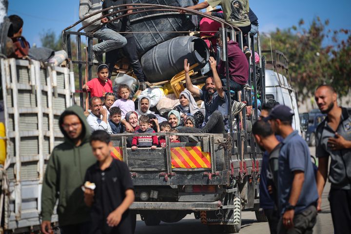 Displaced Palestinians flee Rafah with their belongings to other areas in the southern Gaza Strip on May 7, 2024, following an evacuation order by the Israeli army the previous day.