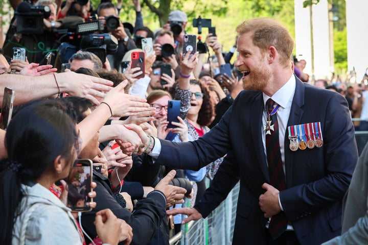 Prince Harry greets the public while departing The Invictus Games Foundation 10th Anniversary Service on May 8.