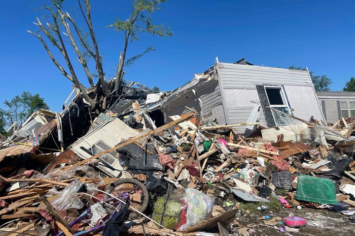 A storm damaged mobile home is surrounded by debris at Pavilion Estates mobile home park just east of Kalamazoo, Mich. on May 8, 2024. A tornado ripped through the area the evening of May 7.
