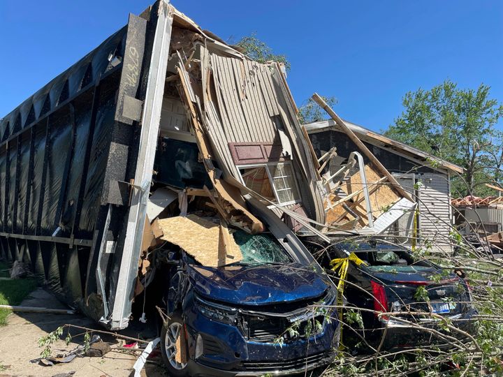 A mobile park home flipped onto two nearby cars after a tornado struck Pavilion Estates near Kalamazoo, Mich. on May 8, 2024.