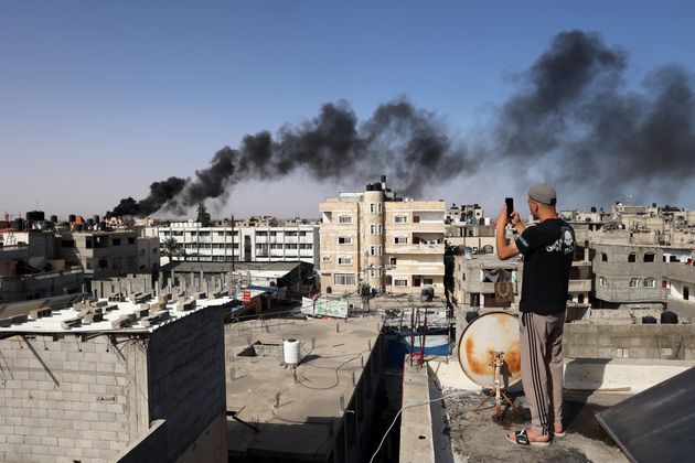 Thick, black smoke rises from a fire in a building caused by Israeli bombardment in Rafah in the southern Gaza Strip on May 10, 2024.