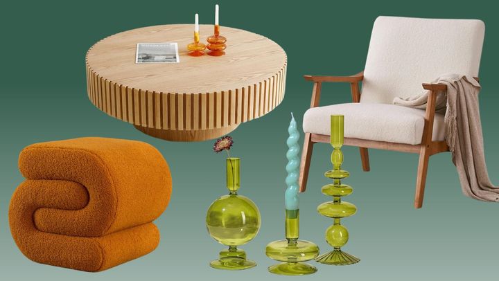 A fuzzy-upholstered ottoman, a round wooden coffee table, a trio of glass bubble candlesticks and and midcentury modern accent chair. 