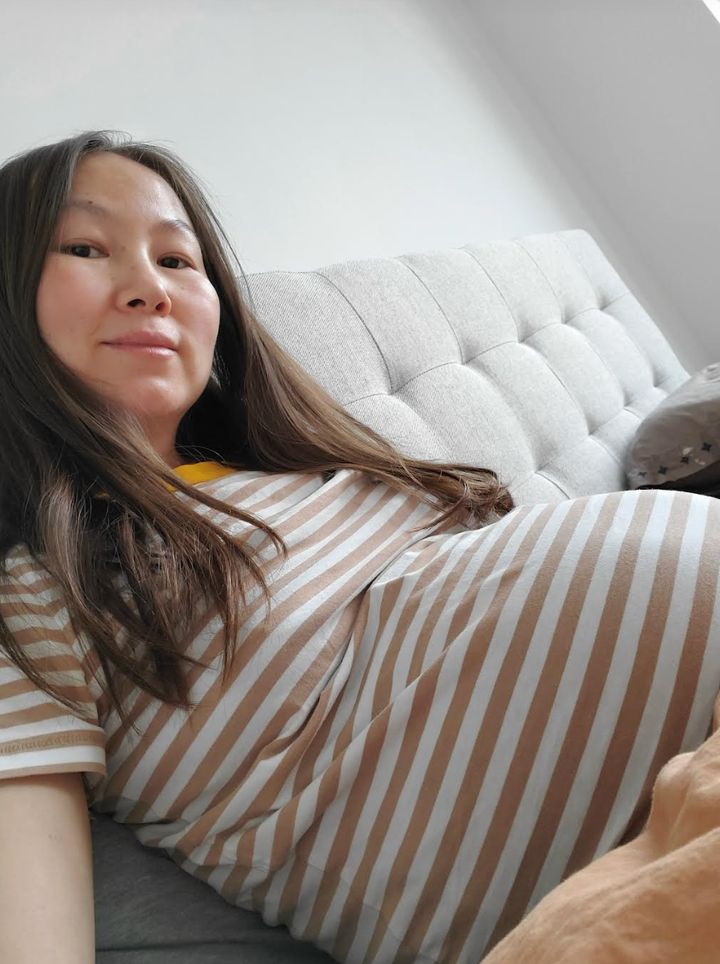 The author at nine months pregnant, in February 2021.
