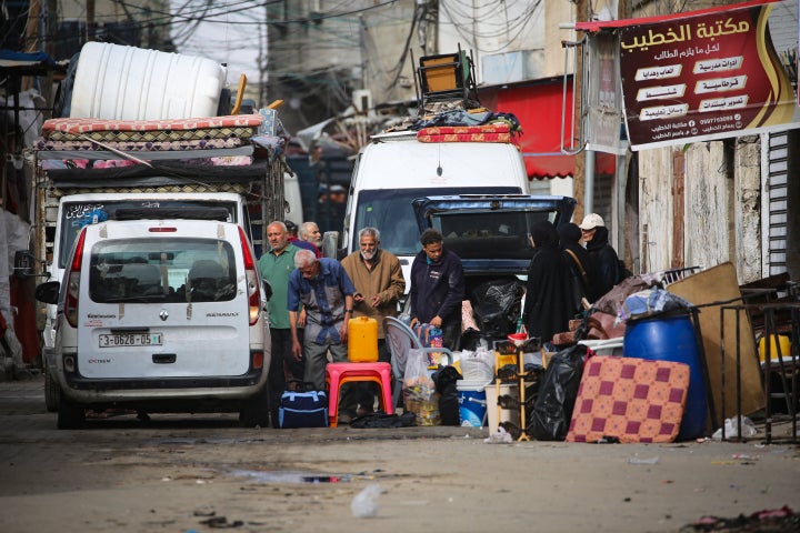 Palestinians gather their belongings as they flee Rafah in the southern Gaza Strip on May 11, 2024. Israeli strikes hit Gaza on May 11 after renewed US criticism over its conduct of the war and a UN warning of "epic" disaster if an outright invasion of crowded Rafah city occurs. (Photo by AFP) (Photo by -/AFP via Getty Images)