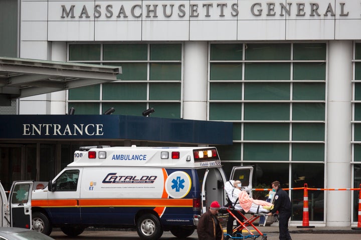 This file photo shows a patient arriving at the Massachusetts General Hospital emergency entrance on Friday, April 3, 2020, in Boston. (AP Photo/Michael Dwyer, File)