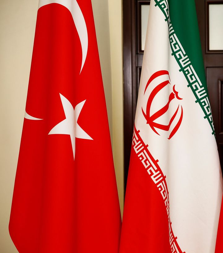 SOCHI, RUSSIA - NOVEMBER 22: National flags of Turkey, Russia and Iran are pictured during the trilateral summit to discuss progress on Syria, between the Presidents of Turkey, Russia and Iran on November 22, 2017 in Sochi, Russia. Turkish President Recep Tayyip Erdogan, Russian President Vladimir Putin and Iranian President Hassan Rouhani attend the meeting. (Photo by Sefa Karacan/Anadolu Agency/Getty Images)