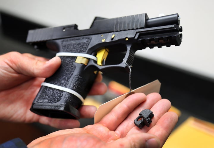 The Boston bureau of the ATF shows a machine gun conversion device for a Glock handgun. The device, which can be made with a 3D printer, can convert the Glock into a machine gun after the "switch" is installed.