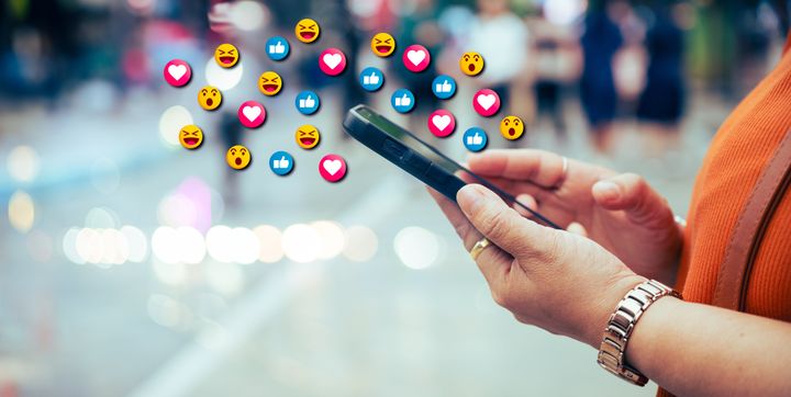 Engaging image of emojis displayed on a smartphone, showcasing expressive digital communication, perfect for social media or messaging concepts.