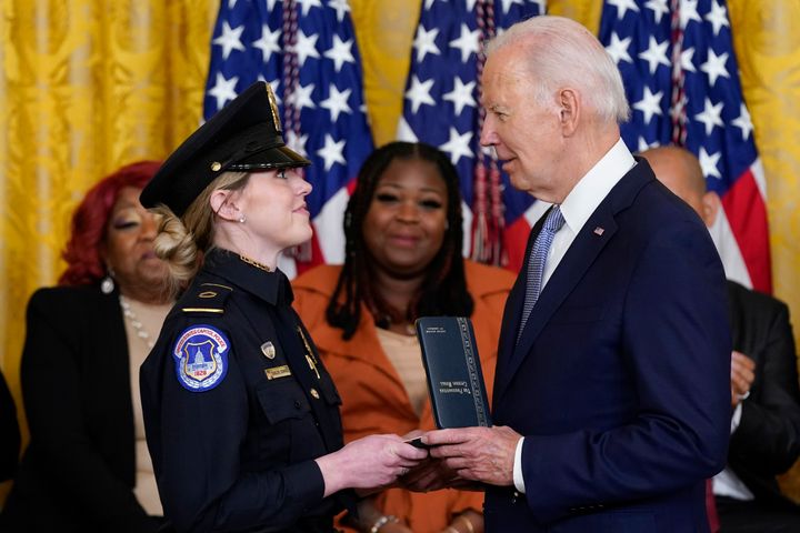 President Joe Biden awards the Presidential Citizens Medal to U.S. Capitol Police officer Caroline Edwards during a ceremony to mark the second anniversary of the Jan. 6 assault on the Capitol in the East Room of the White House in Washington, Friday, Jan. 6, 2023.