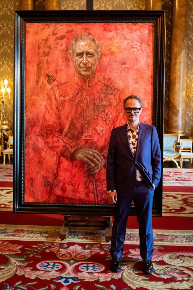 Artist Jonathan Yeo stands in front of his official portrait of King Charles III wearing the uniform of the Welsh Guards, of which he was made regimental colonel in 1975, in the Blue Drawing Room at Buckingham Palace in London on May 14.