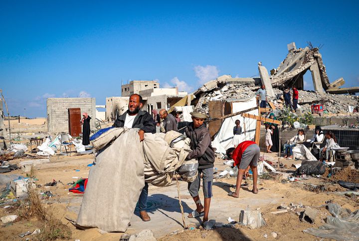 Displaced Palestinians pack their belongings before leaving an unsafe area in Rafah, Gaza, on Wednesday. About 450,000 Gazans have fled the city amid Israeli military operations.