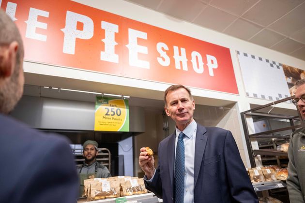 Jeremy Hunt tries some food as he visits a Morrisons store in London last month.