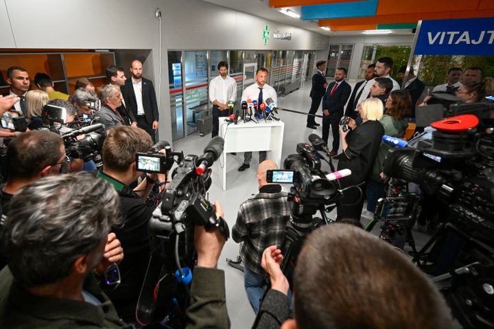 Slovakia's Interior Minister Matus Sutaj Estok speaks during a joint press conference with Deputy Prime Minister and Defence Minister of Slovakia Robert Kalinak, left, at the F. D. Roosevelt University Hospital, where Slovak Prime Minister Robert Fico, who was shot and injured, is treated in Banska Bystrica, central Slovakia, Wednesday, May 15, 2024. (AP Photo/Denes Erdos)