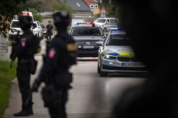 Policemen guard the area as convoy brings the suspect, in shooting of Slovakia's Prime Minister Robert Fico, to court in Pezinok, Slovakia, Saturday, May 18, 2024. (AP Photo/Tomas Benedikovic)