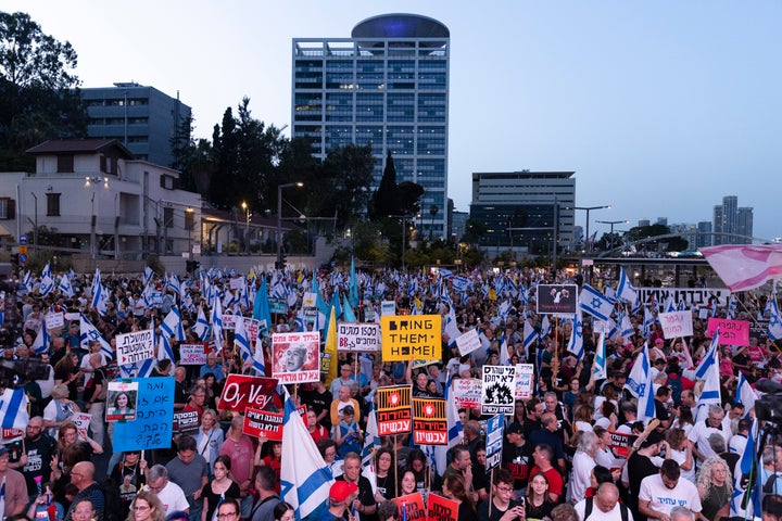 Protesters hold Israeli flags and signs during a demonstration calling for a hostage deal on May 18, 2024 in Tel Aviv, Israel. Demonstrators protested against Israeli Prime Minister Benjamin Netanyahu and his government, who has so far refused to strike a cease-fire deal that would bring prisoners that Hamas took captive in its Oct. 7 attack.