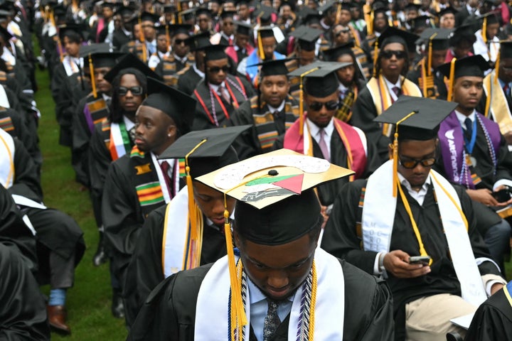 Morehouse College valedictorian DeAngelo Jeremiah Fletcher (front C) wears his graduation cap decorated like the Palestinian flag, before President Joe Biden speaks during the HBCU's graduation ceremony in Atlanta, Georgia on May 19, 2024.