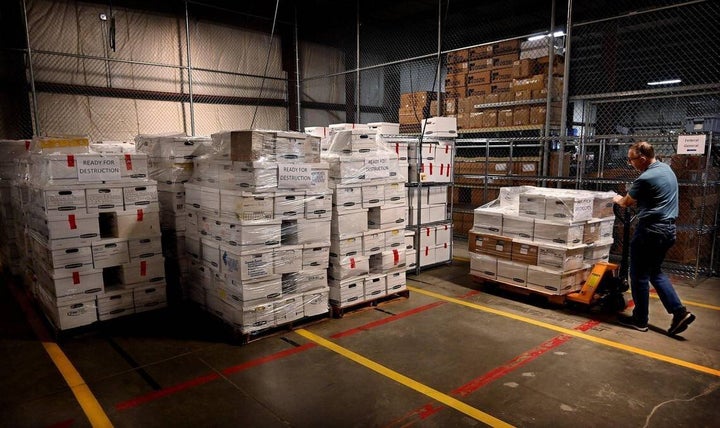 At the Johnson County Election Office, Al Sneller, an employee in the warehouse, moves dozens of boxes into storage that contain ballots, documents and other paperwork from the 2020 general and primary elections, and the Aug. 2, 2022 primary election.