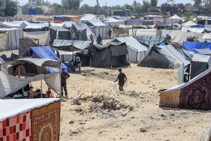 Palestinians emigrated from Rafah due to Israeli attacks set encampments on empty fields in the area between Deir al Balah and Khan Yunis in Gaza on May 21, 2024.